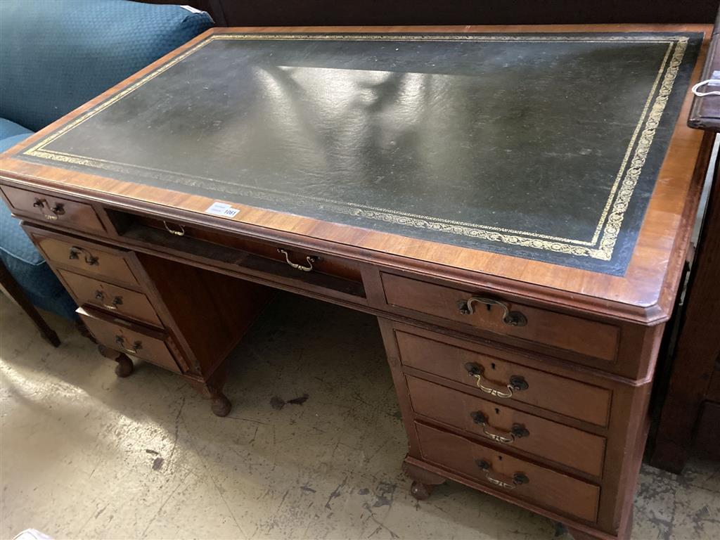 A George III style walnut pedestal desk, fitted nine small drawers, width 154cm, depth 92cm, height 77cm